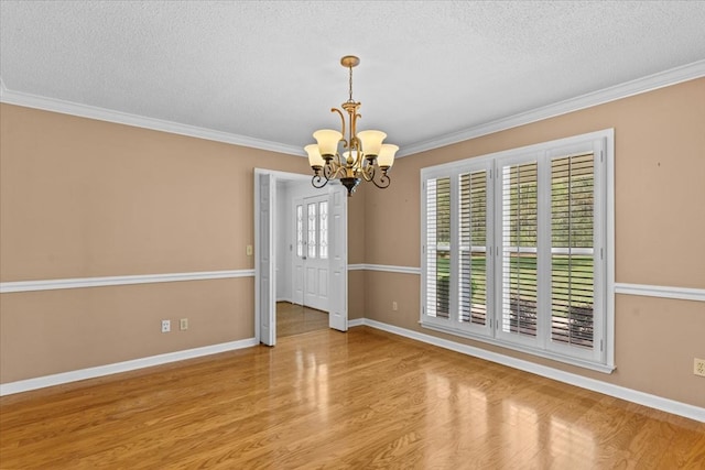 105 Christen Ln, Dothan, AL 36305 - unfurnished room with a textured ceiling, wood finished floors, a chandelier, and crown molding