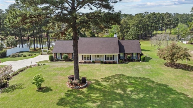 105 Christen Ln, Dothan, AL 36305 - view of front of house with a chimney, a porch, driveway, and a front lawn