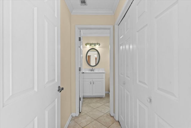 105 Christen Ln, Dothan, AL 36305 - hall featuring a sink, visible vents, ornamental molding, and light tile patterned floors