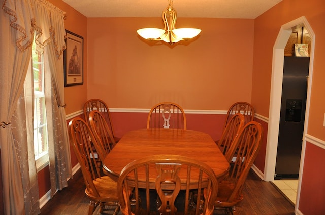 dining area with dark hardwood / wood-style floors