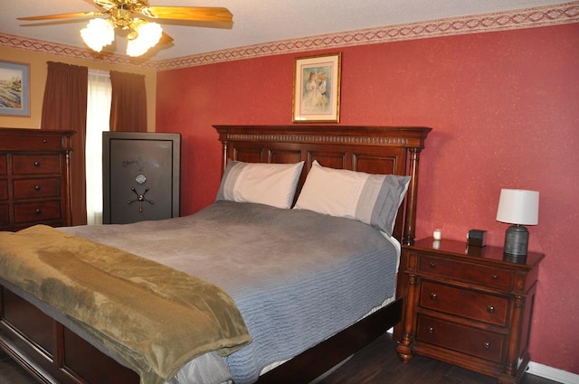 bedroom with dark wood-type flooring and ceiling fan