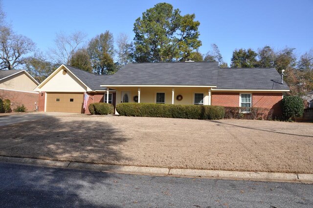 ranch-style home featuring a garage