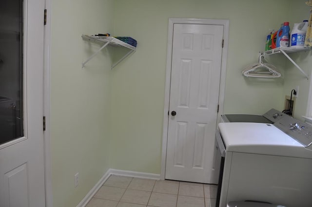 washroom with light tile patterned flooring and independent washer and dryer