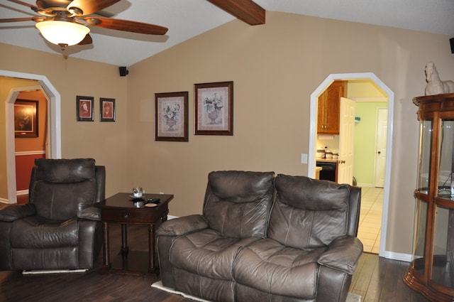 living room with lofted ceiling with beams, ceiling fan, and dark hardwood / wood-style flooring