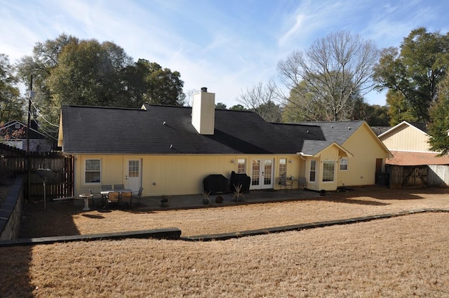 rear view of property with french doors