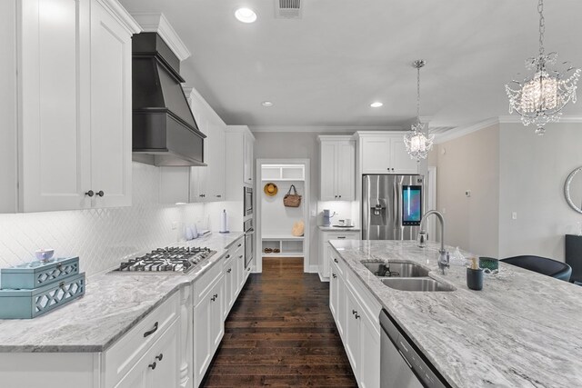114 Bozeman Way, Dothan, AL 36305 - kitchen with a sink, appliances with stainless steel finishes, custom range hood, a chandelier, and recessed lighting
