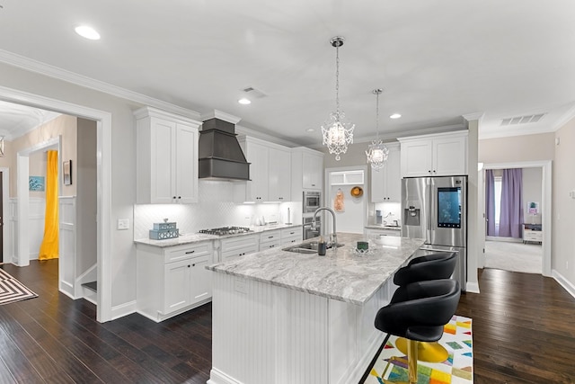 114 Bozeman Way, Dothan, AL 36305 - kitchen with appliances with stainless steel finishes, a sink, premium range hood, dark wood-style floors, and a kitchen island with sink