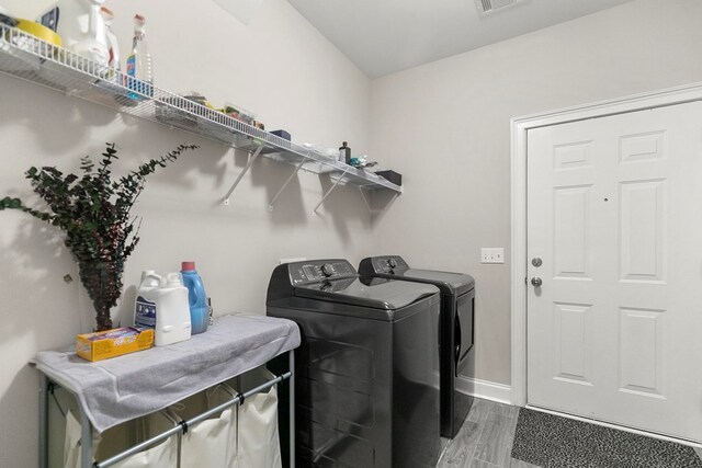 114 Bozeman Way, Dothan, AL 36305 - washroom featuring separate washer and dryer, wood finished floors, and baseboards