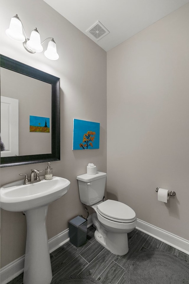 114 Bozeman Way, Dothan, AL 36305 - bathroom with toilet, baseboards, and a sink