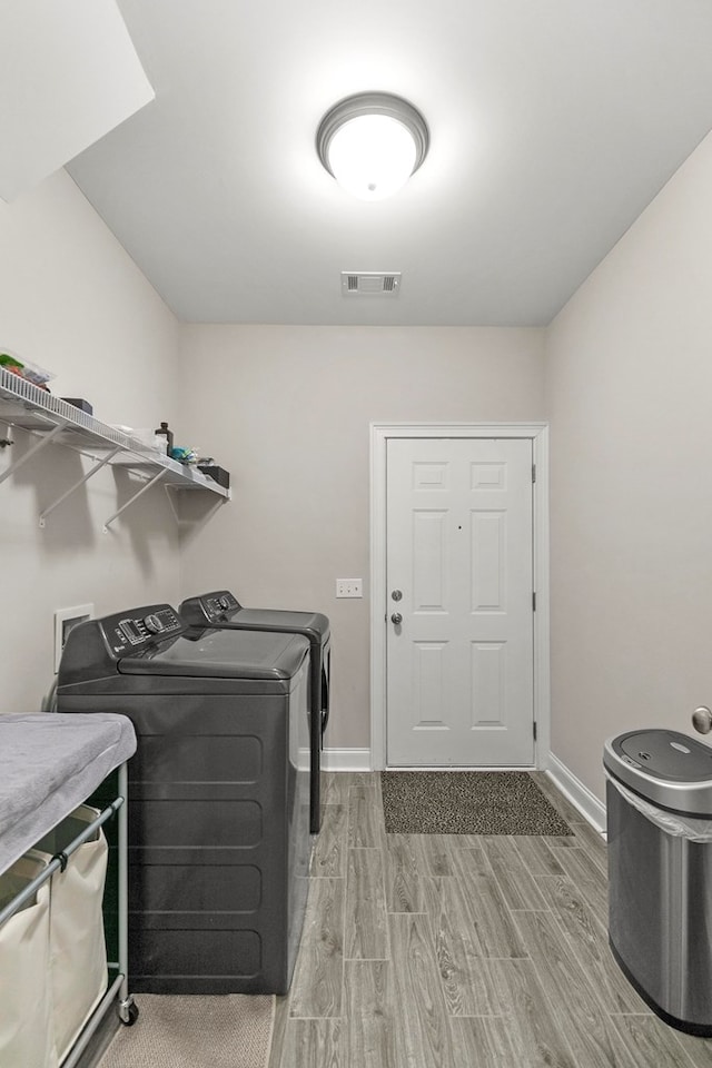 114 Bozeman Way, Dothan, AL 36305 - washroom with independent washer and dryer, wood tiled floors, and baseboards