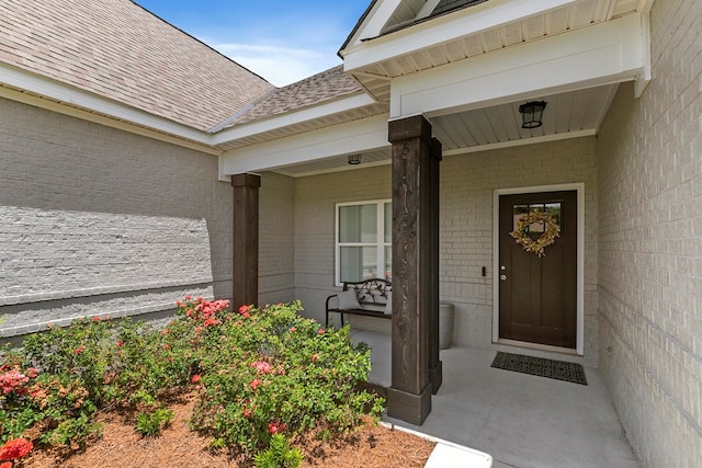 114 Bozeman Way, Dothan, AL 36305 - entrance to property with a shingled roof, brick siding, and covered porch