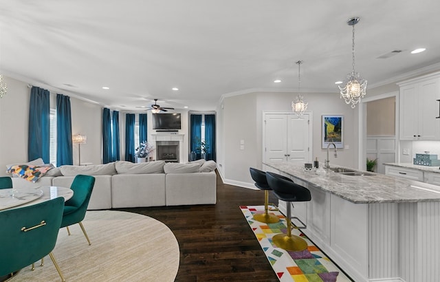 114 Bozeman Way, Dothan, AL 36305 - kitchen featuring a sink, white cabinetry, recessed lighting, dark wood-style flooring, and ornamental molding