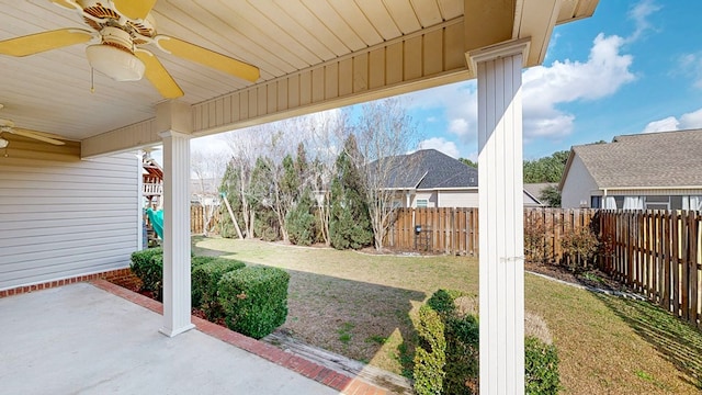 view of yard with a patio area and ceiling fan