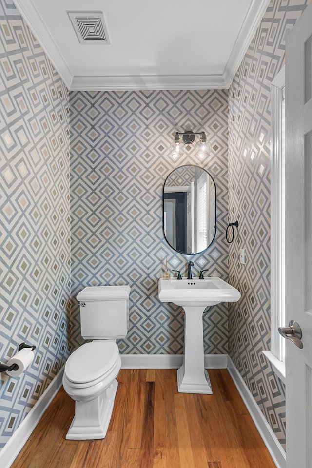 109 Glencoe Way, Dothan, AL 36305 - bathroom featuring ornamental molding, wallpapered walls, and wood finished floors