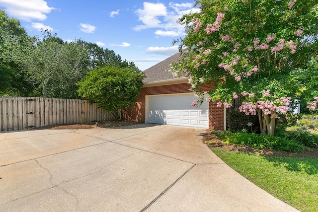 109 Glencoe Way, Dothan, AL 36305 - view of side of property featuring brick siding, driveway, a garage, and a shingled roof