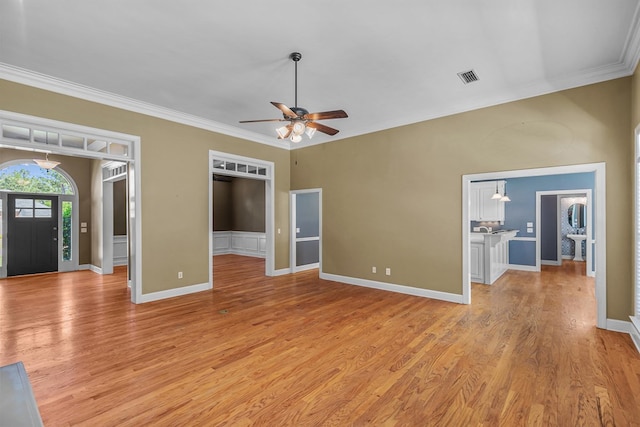 109 Glencoe Way, Dothan, AL 36305 - unfurnished living room featuring ornamental molding, ceiling fan, and light wood-type flooring