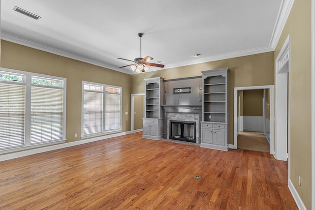 109 Glencoe Way, Dothan, AL 36305 - unfurnished living room with a fireplace, crown molding, light wood-type flooring, and ceiling fan