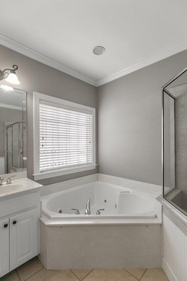 109 Glencoe Way, Dothan, AL 36305 - bathroom featuring a tub with jets, tile patterned floors, vanity, crown molding, and a shower