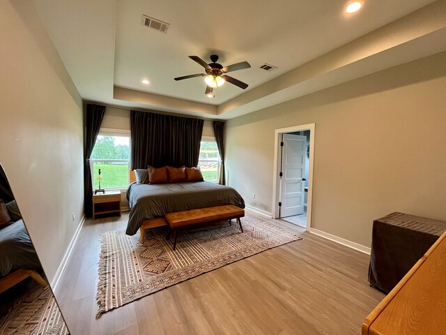 212 Neenan Dr, Enterprise, AL 36330 - bedroom featuring light wood finished floors, baseboards, a tray ceiling, recessed lighting, and ceiling fan
