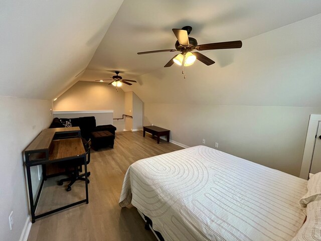 212 Neenan Dr, Enterprise, AL 36330 - bedroom featuring wood finished floors, baseboards, vaulted ceiling, and a ceiling fan