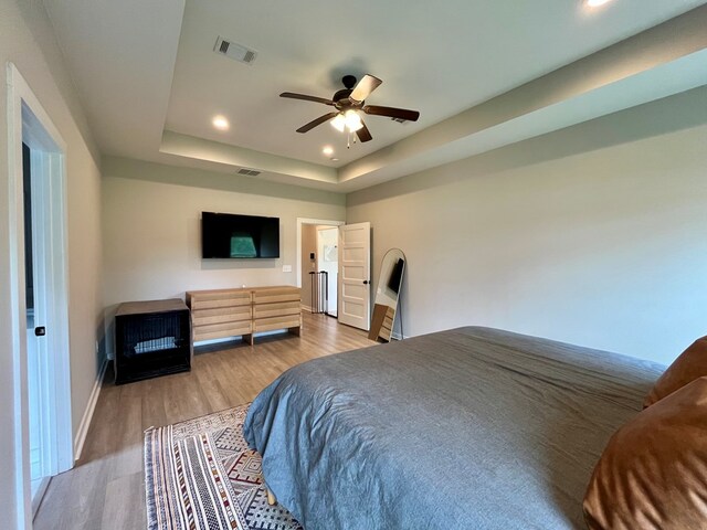 212 Neenan Dr, Enterprise, AL 36330 - bedroom featuring wood finished floors, baseboards, recessed lighting, a raised ceiling, and ceiling fan