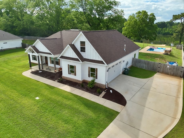 212 Neenan Dr, Enterprise, AL 36330 - modern farmhouse style home featuring board and batten siding, roof with shingles, driveway, and a gate