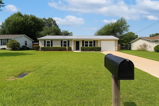 227 Dahlia Dr, Taylor, AL 36301 - ranch-style home featuring a garage, concrete driveway, a front yard, and a metal roof