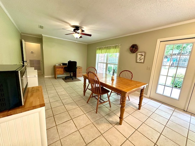 1317 Cambridge Rd, Dothan, AL 36305 - dining space featuring crown molding, light tile patterned floors, ceiling fan, a textured ceiling, and an office area