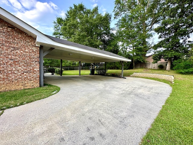 1317 Cambridge Rd, Dothan, AL 36305 - view of parking featuring driveway and an attached carport