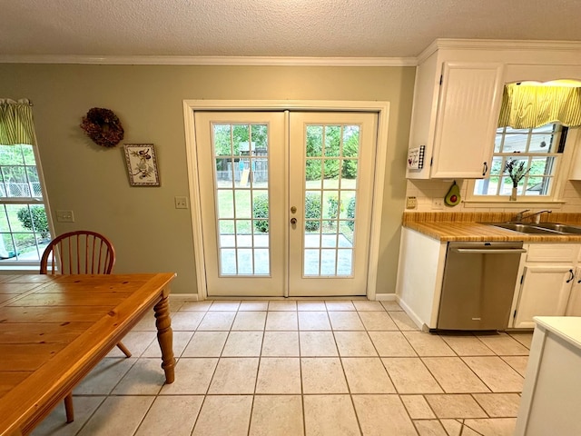 1317 Cambridge Rd, Dothan, AL 36305 - doorway to outside with a sink, french doors, crown molding, baseboards, and light tile patterned flooring