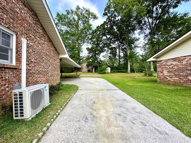 1317 Cambridge Rd, Dothan, AL 36305 - view of grassy yard with driveway and ac unit