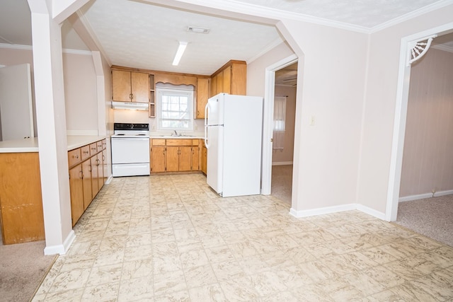 kitchen featuring white appliances, visible vents, arched walkways, under cabinet range hood, and a sink