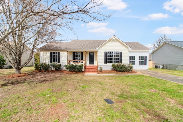 ranch-style house with a front yard, covered porch, roof with shingles, and central air condition unit