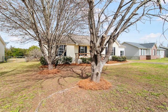 ranch-style home with brick siding and a front lawn