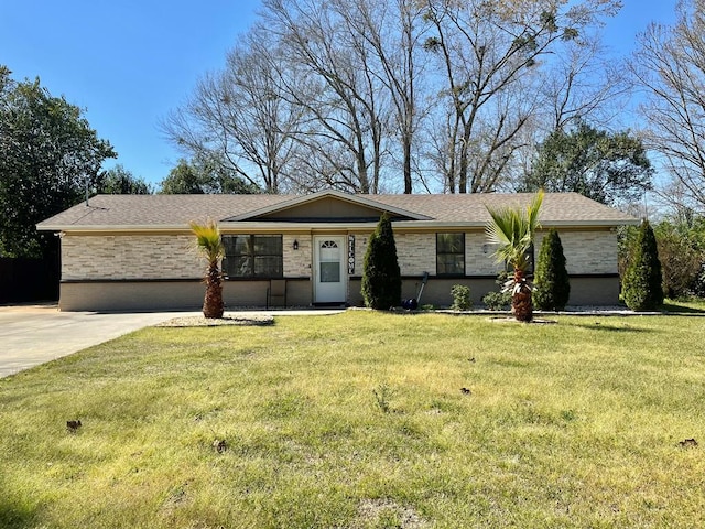 view of front of property featuring stone siding and a front yard