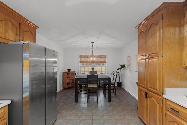 dining area with dark tile patterned floors