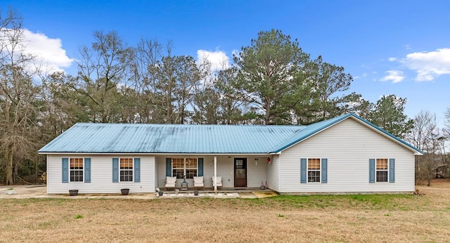 view of front of house with a front yard and a porch