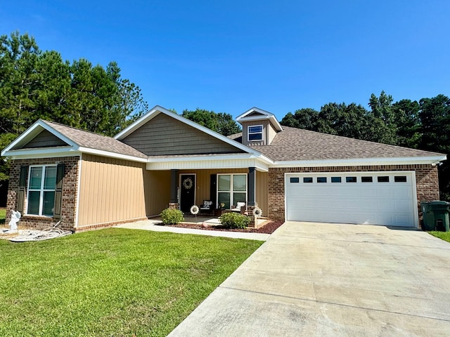 125 Sandpiper Ln, Dothan, AL 36301 - view of front facade featuring brick siding, a garage, and a front yard