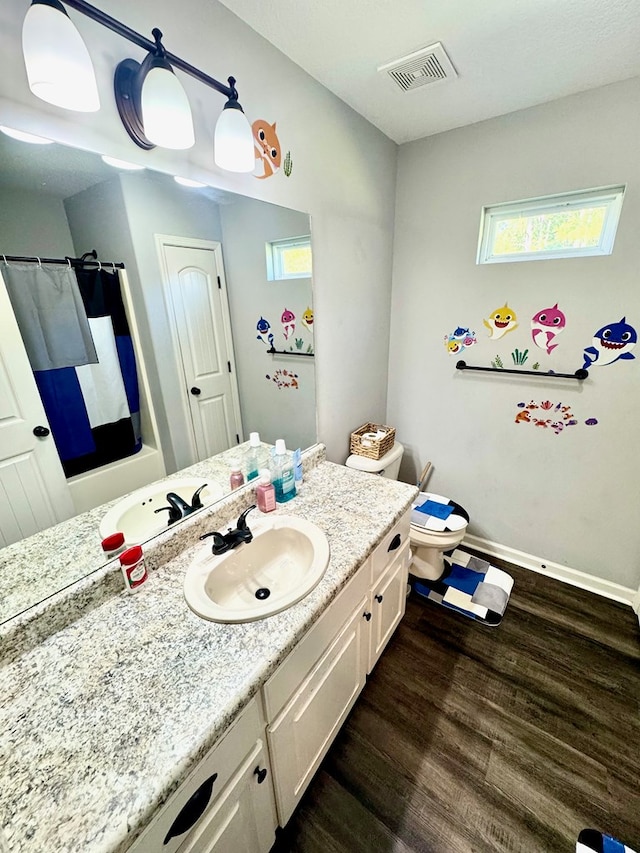 125 Sandpiper Ln, Dothan, AL 36301 - full bathroom with wood finished floors, vanity, and curtained shower