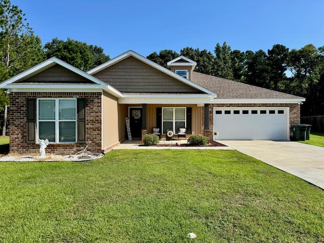 125 Sandpiper Ln, Dothan, AL 36301 - view of front of property with driveway, a garage, a front lawn, and covered porch