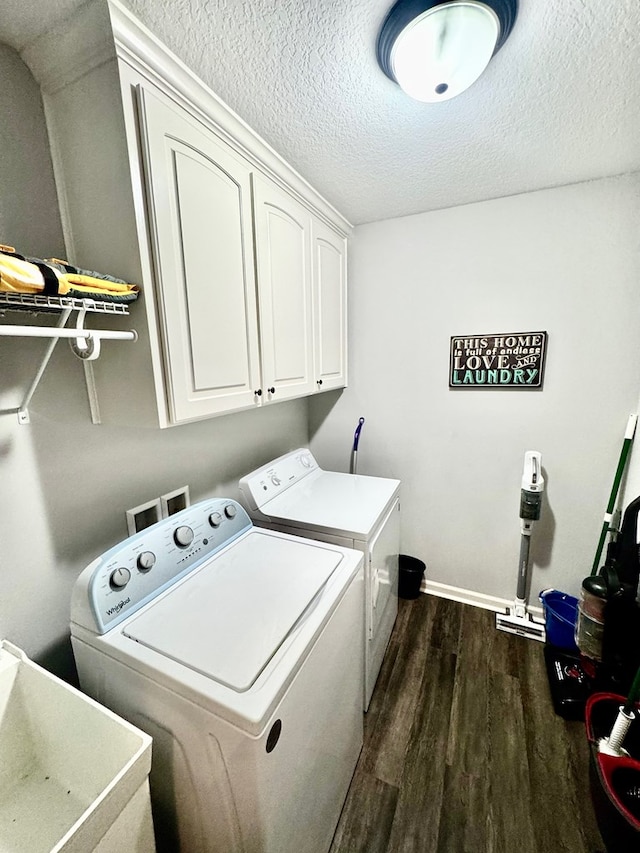 125 Sandpiper Ln, Dothan, AL 36301 - laundry area with washer and dryer, cabinet space, dark wood-style floors, and a textured ceiling