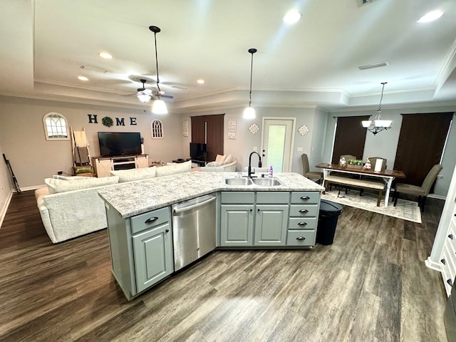 125 Sandpiper Ln, Dothan, AL 36301 - kitchen featuring dark wood-style floors, a tray ceiling, open floor plan, dishwasher, and a kitchen island with sink