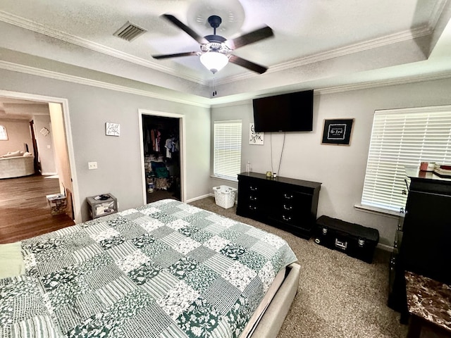 125 Sandpiper Ln, Dothan, AL 36301 - bedroom featuring ornamental molding, ceiling fan, a closet, a tray ceiling, and carpet flooring