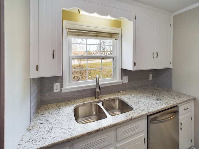 kitchen with sink, white cabinets, and stainless steel dishwasher