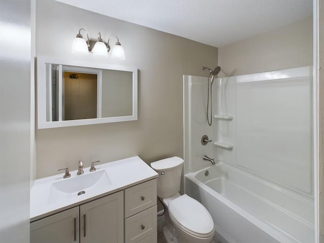 full bathroom featuring a textured ceiling, vanity, toilet, and  shower combination