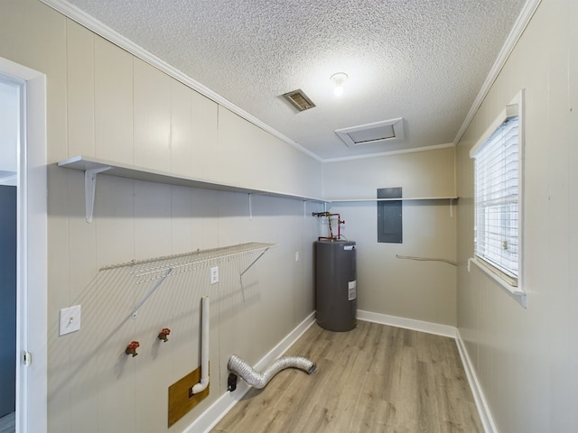 laundry room with electric water heater, electric panel, light hardwood / wood-style floors, a textured ceiling, and ornamental molding