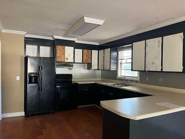 kitchen featuring sink, crown molding, tasteful backsplash, black appliances, and dark hardwood / wood-style flooring