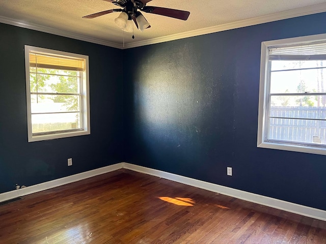 empty room with crown molding, a textured ceiling, ceiling fan, and hardwood / wood-style flooring