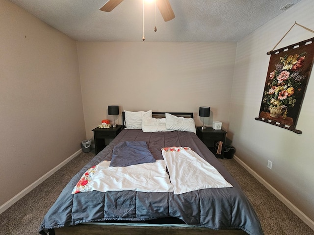 carpeted bedroom featuring baseboards, ceiling fan, and a textured ceiling