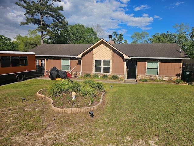 ranch-style house featuring roof with shingles, a chimney, a front yard, and stone siding